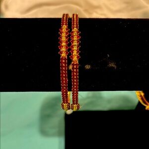 Elegant Gold and Red Beaded Bangles